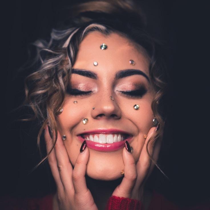 Kaveri Mehta, Lead Design Curator at Sunset Maple Root, reviewing corporate floral arrangements